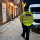 An officer walking past a pub in Coleshill