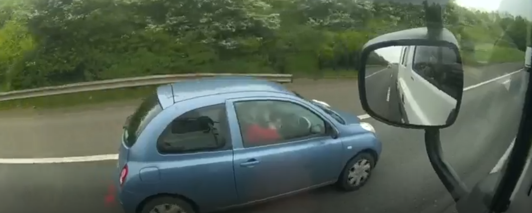 You couldn’t make it up! Shocking footage of driver putting on her make-up as she drives along the M40