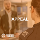 Appeal graphic showing an officer at a station front desk speaking to a member of the public showing the force logo